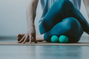 Person,Doing,Yin,Yoga,And,Myofascial,Release,On,Shin,Muscle.
